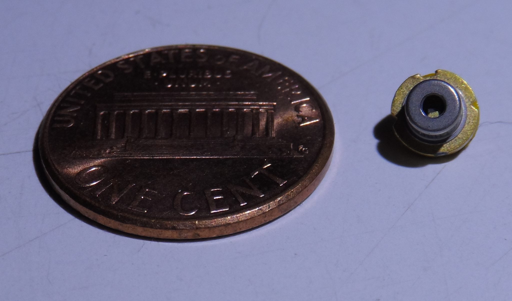 Laser diode with penny for scale.